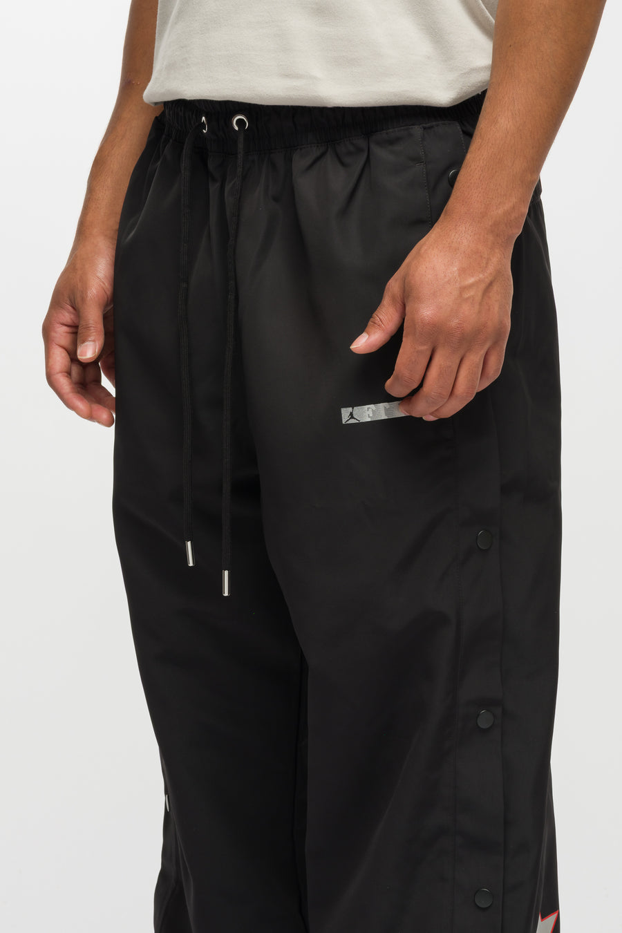Jordan Free the Youth Track Pant in Black/Light Crimson - Notre