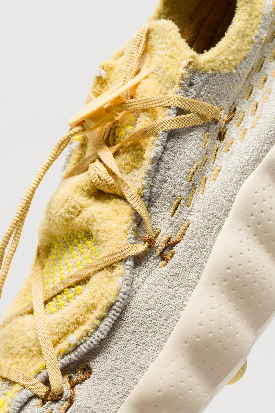 Nike Mind 002 Flyknit Sneaker in Light Bone/Saturn Gold/Infinite Gold - Notre