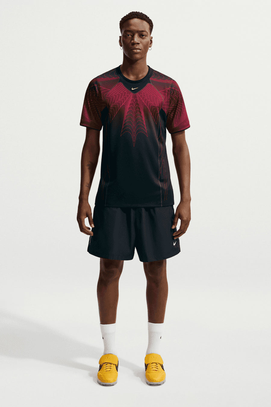 Nike NOCTA x Canada Short Sleeve Top in Black/University Red/Sonic Yellow - Notre