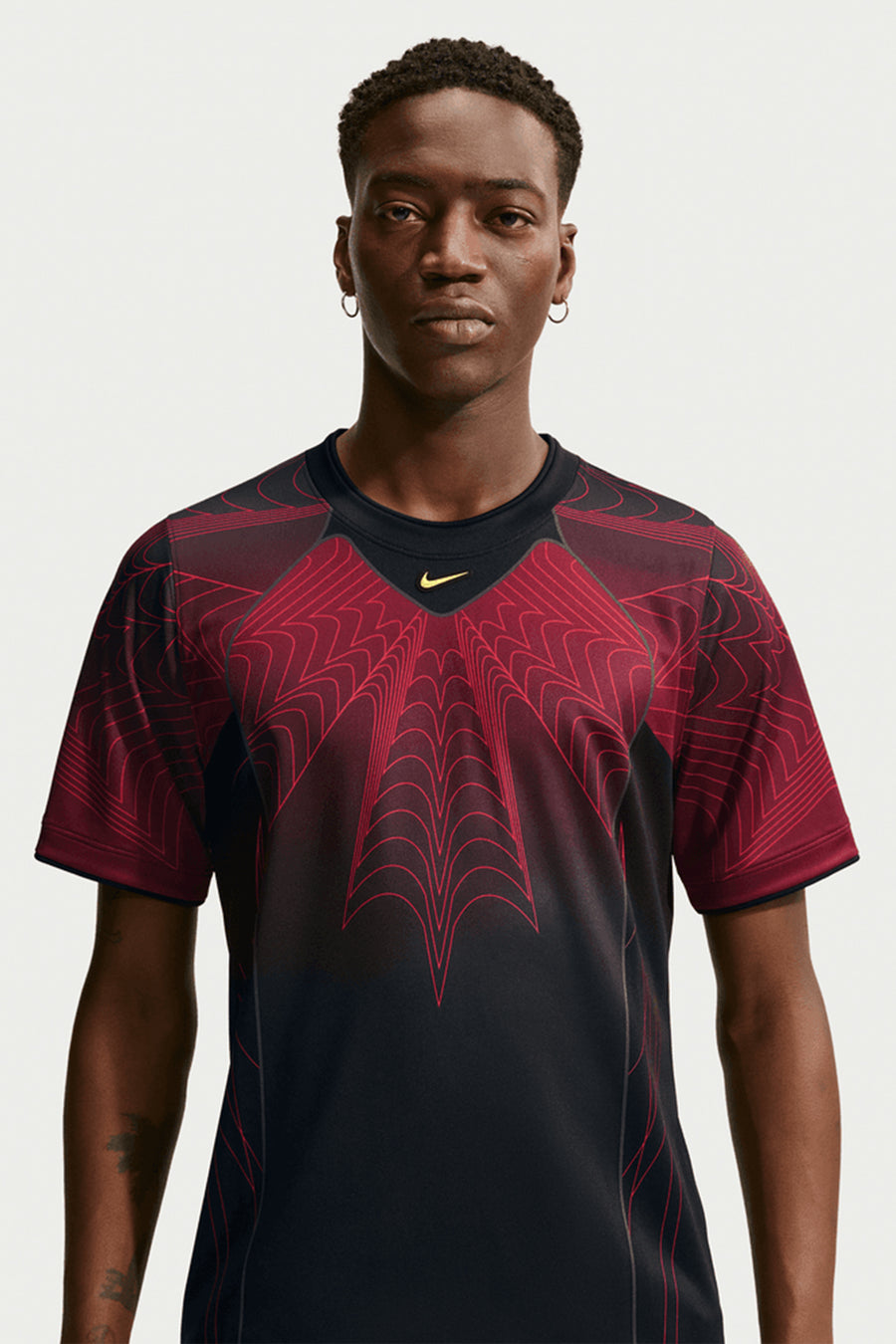 Nike NOCTA x Canada Short Sleeve Top in Black/University Red/Sonic Yellow - Notre